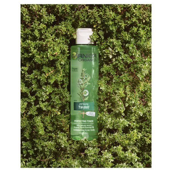 Garnier Organics Thyme Perfecting Toner product laying in thyme